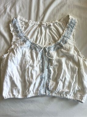 White Embroidered Sleeveless Crop Top with Blue Accents 🧵🕊️